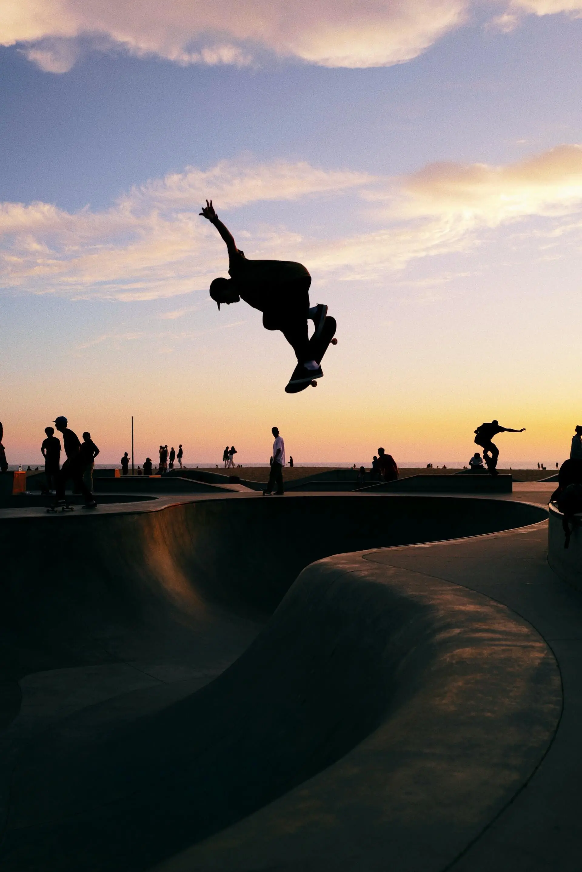 A skateboarder dropping into a bowl